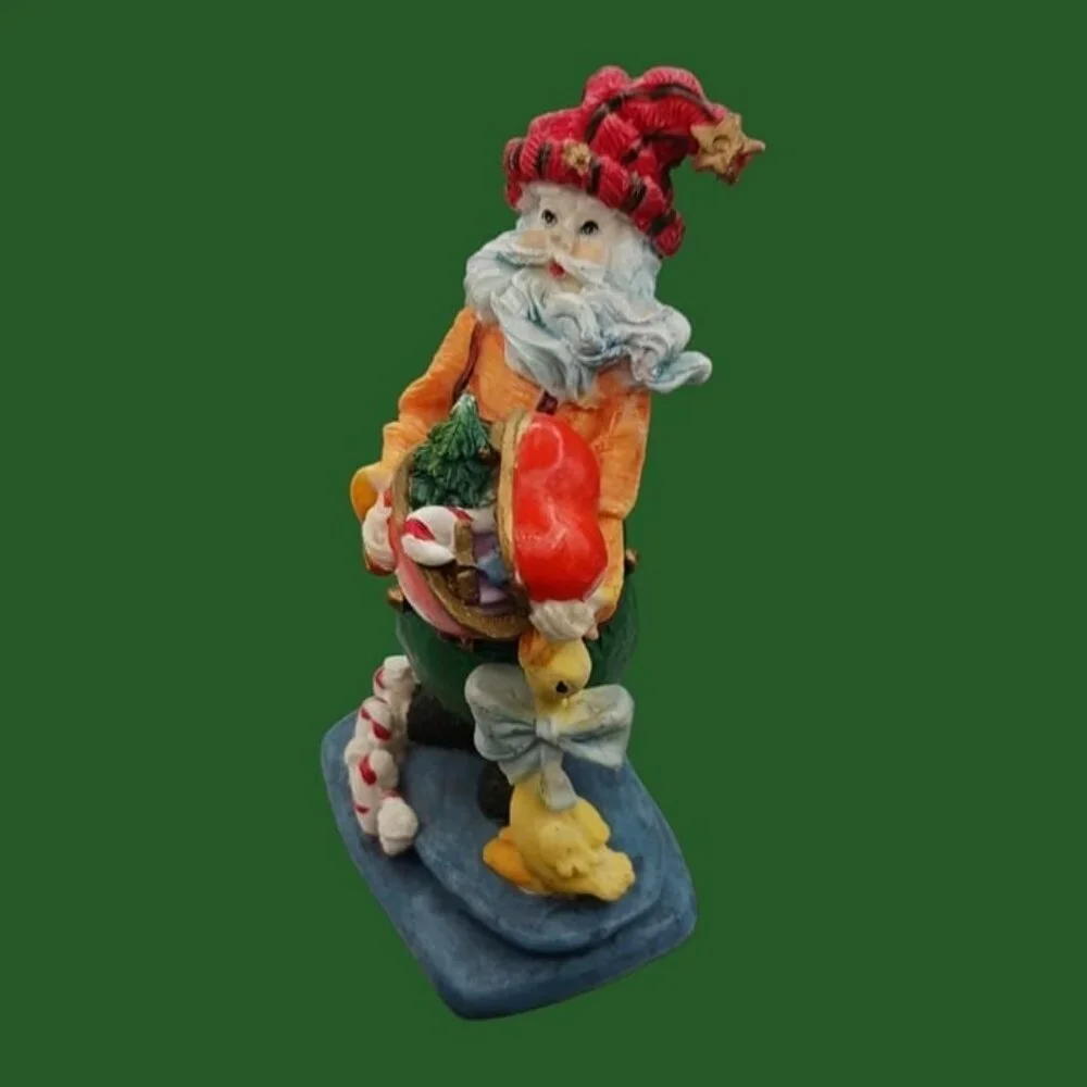 Santa claus figurine with gift and duck